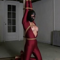 Sweet bound Sarah Brooke with ropes is fitted with a tight leather hood in hugging spandex catsuit - Hooded and Tormented in the Basement Dungeon HD