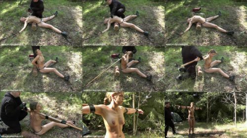 Outdoor bondage - Stretched Juliette in a spread eagle in the woods - Subjugated Outdoors - Juliette Tied to a Bar
