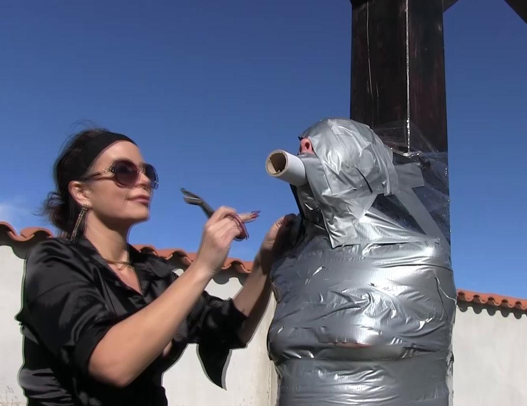 Mummification bondage - Rachel Adams is mummified outdoors with tape - Female bondage - Outdoor bondage
