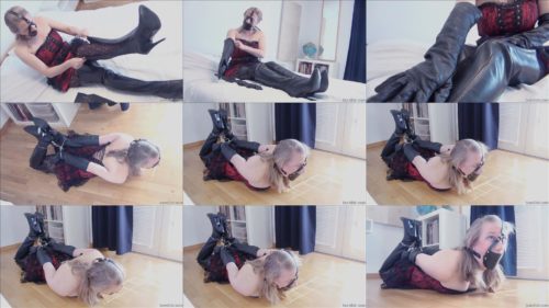 Strict bondage - Dina is hogtied and cuffed with three pairs of handcuffs into leather thighboots - This position is  painful