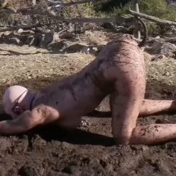 Bondage Life – Stuck In The Mud - Rachel Greyhound is Chained to 2 stakes in the backyard
