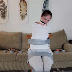 Rachel Adams - Gagged and Vanishing Under Tape - Cinched and Secured