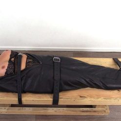 Lori strapped in a body bag - Leather Bondage