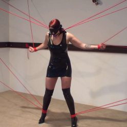 Sexy Slut in Latex, Ball Gagged, Blindfolded, Bound With Red Rope Spread Eagle